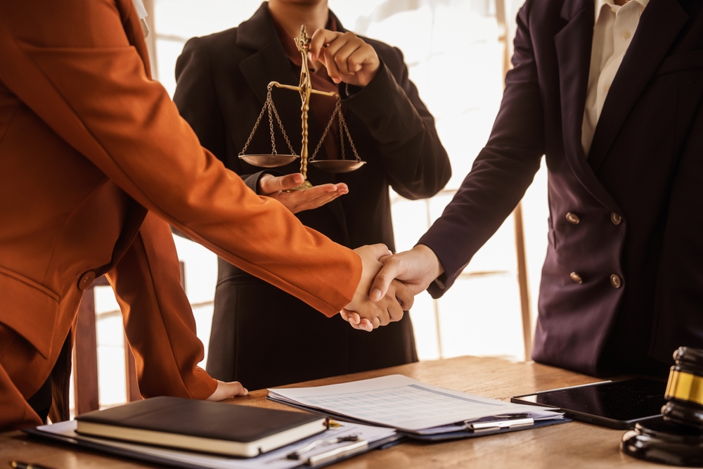 Lawyer and a client settling a personal injury case